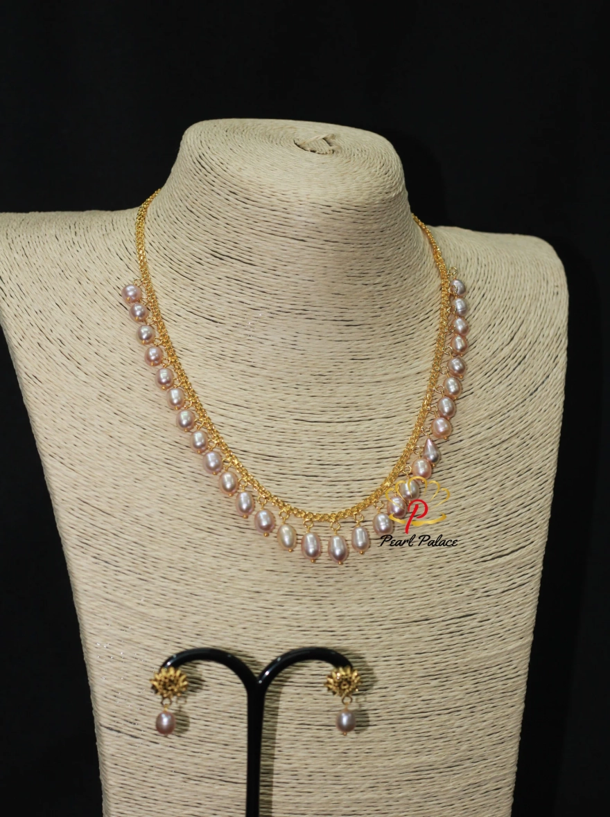 Peach Rice Pearl and Gold-Plated Necklace and Earring Set.