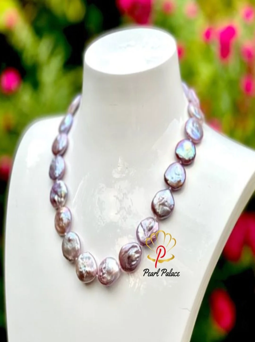 A magnificent, and very rare tone of large Freshwater Baroque Coin pearls.